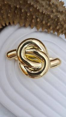 Broche moño nudo dorado